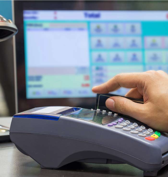 Professional commercial Point of Sale POS system installation with integrated card reader and touchscreen terminal on a clean business counter.
