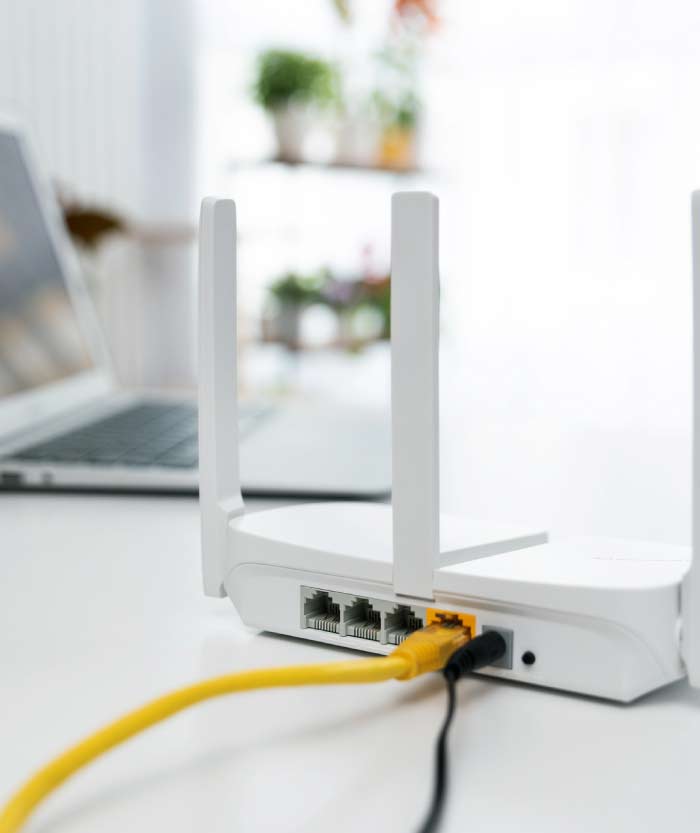 High-performance commercial Wi-Fi router with ethernet cabling providing a stable network for business operations.