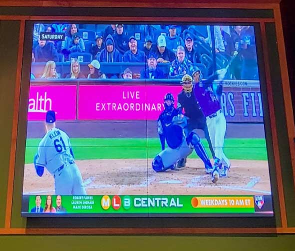 large television screen mounted on the wall